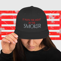 IT PUTS THE MEAT IN THE SMOKER